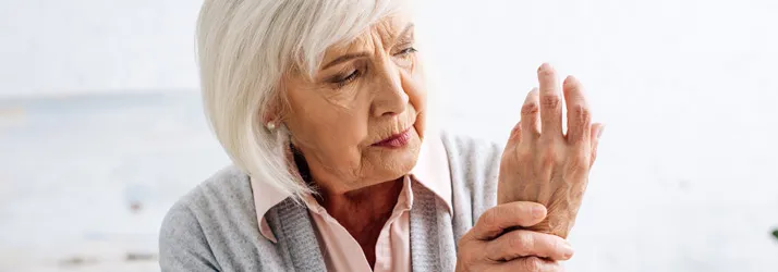 A woman holding her hand.